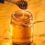 Jar of pure raw honey representing honey in Pakistan