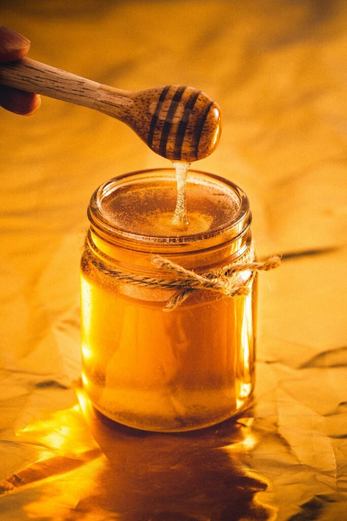 Jar of pure raw honey representing honey in Pakistan