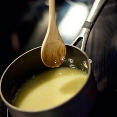 Golden pure desi ghee melting, representing organic ghee in Pakistan